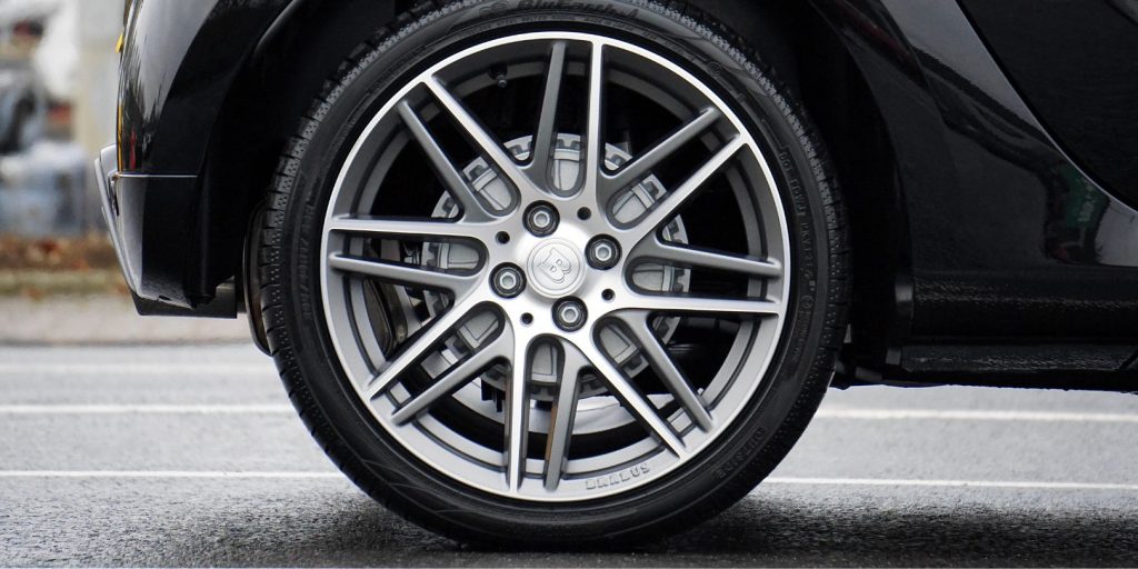 Close-up Photograph of Chrome Vehicle Wheel
