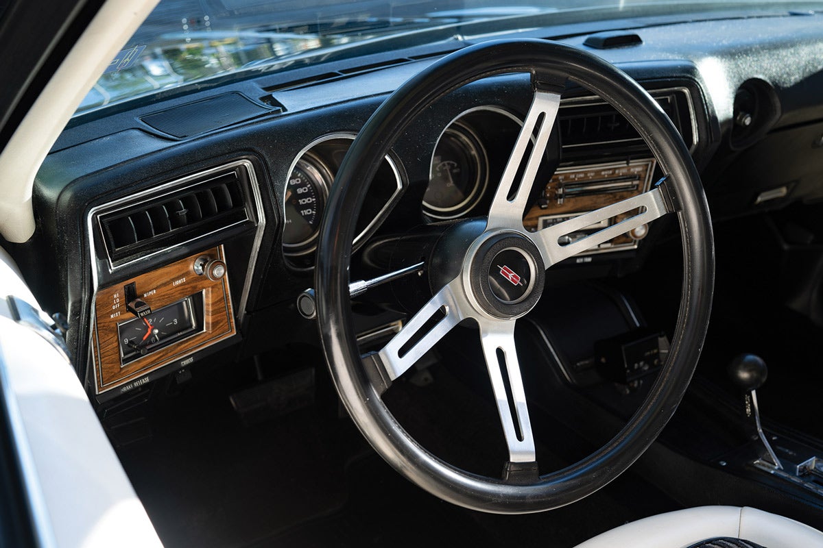 Oldsmobile’s sporty four-spoke Custom sport steering wheel with “soft grip” is fitted to the Hurst/Olds. Oldsmobile touted how the dash components of all Cutlass models were easily removable for service.