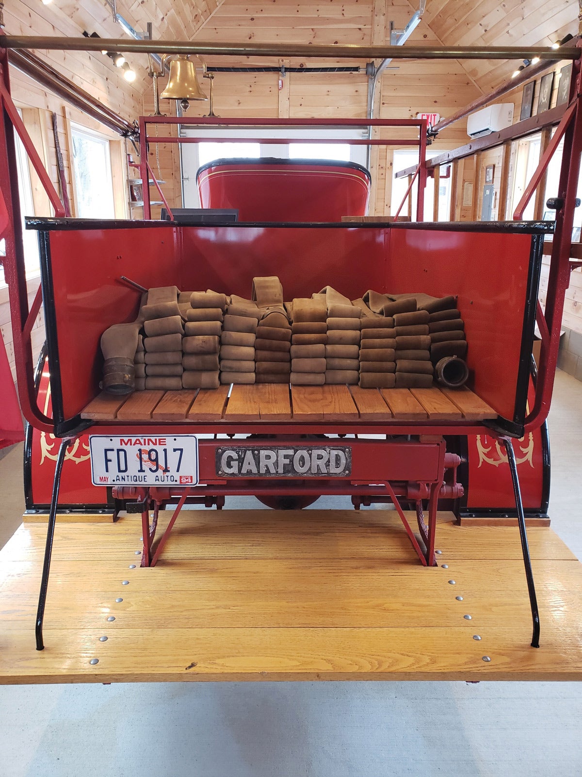 Coiled hose in the back offers insight into the fire-fighting truck’s original purpose as a hose and chemical truck.