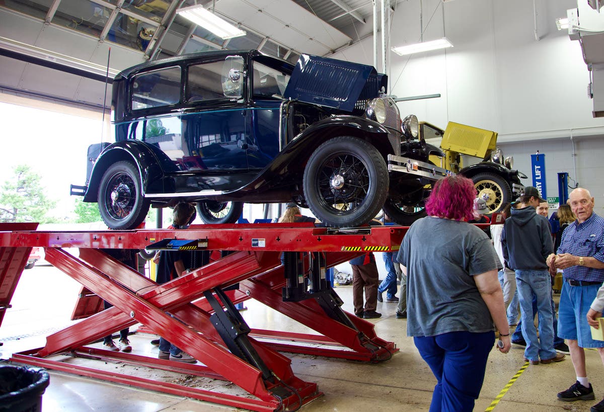 A two-door 1931 Model A Ford is placed on a lift at Francis Tuttle Technology Center for Automotive Service Technology students to view. The OKC Model A Restorers Group brought several cars for students to see on Monday, May 5.