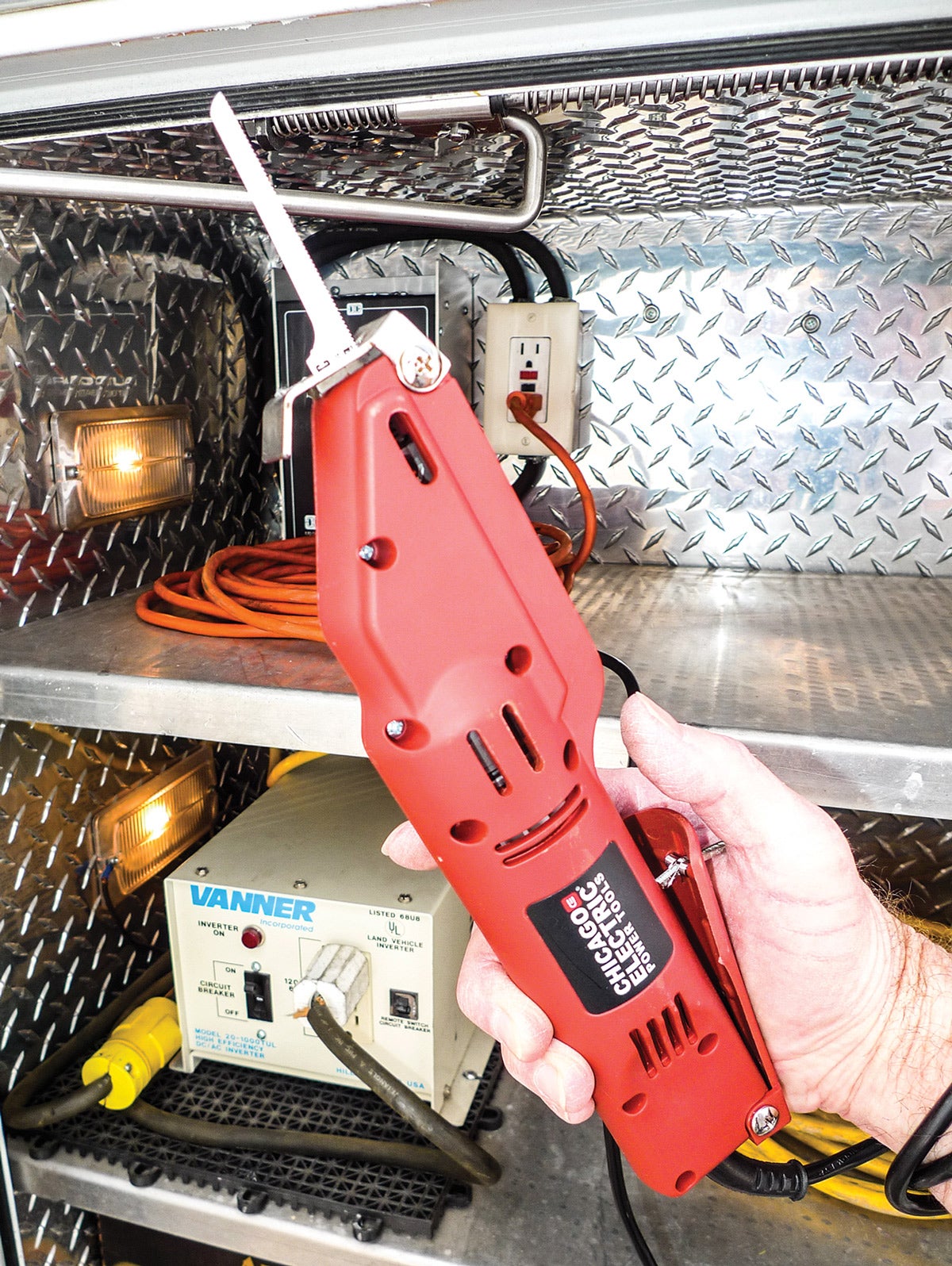 We could’ve chosen the cordless version of our new body saw, but see the invertor? Since we’ve already got AC power on tap, we’re opting to run with that.