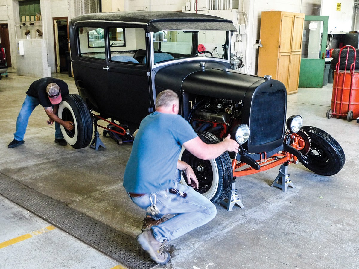 With the formerly offending ’70s wheels and tires rolled far away and out of the picture, this is a positive pit stop. Reproduction ’41 Ford hubcaps and trim rings are coming right up