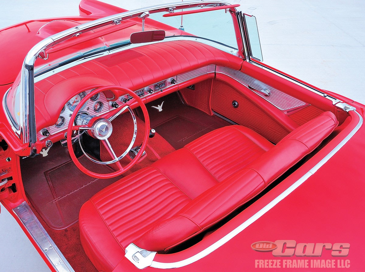 The comfy cockpit of the 1957 Thunderbird featured an engine-turned panel that went from door to door and across the instrument panel face.