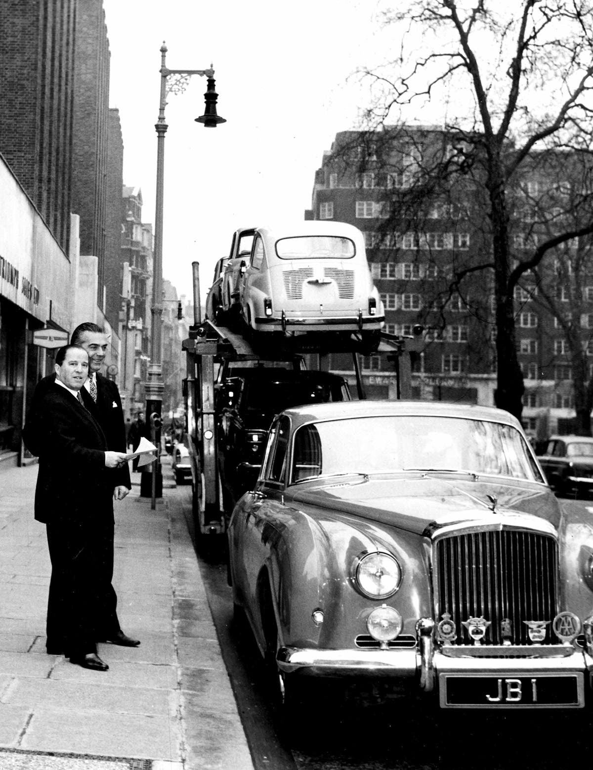 J D Barclay with a Bentley baring the number plate JB1.