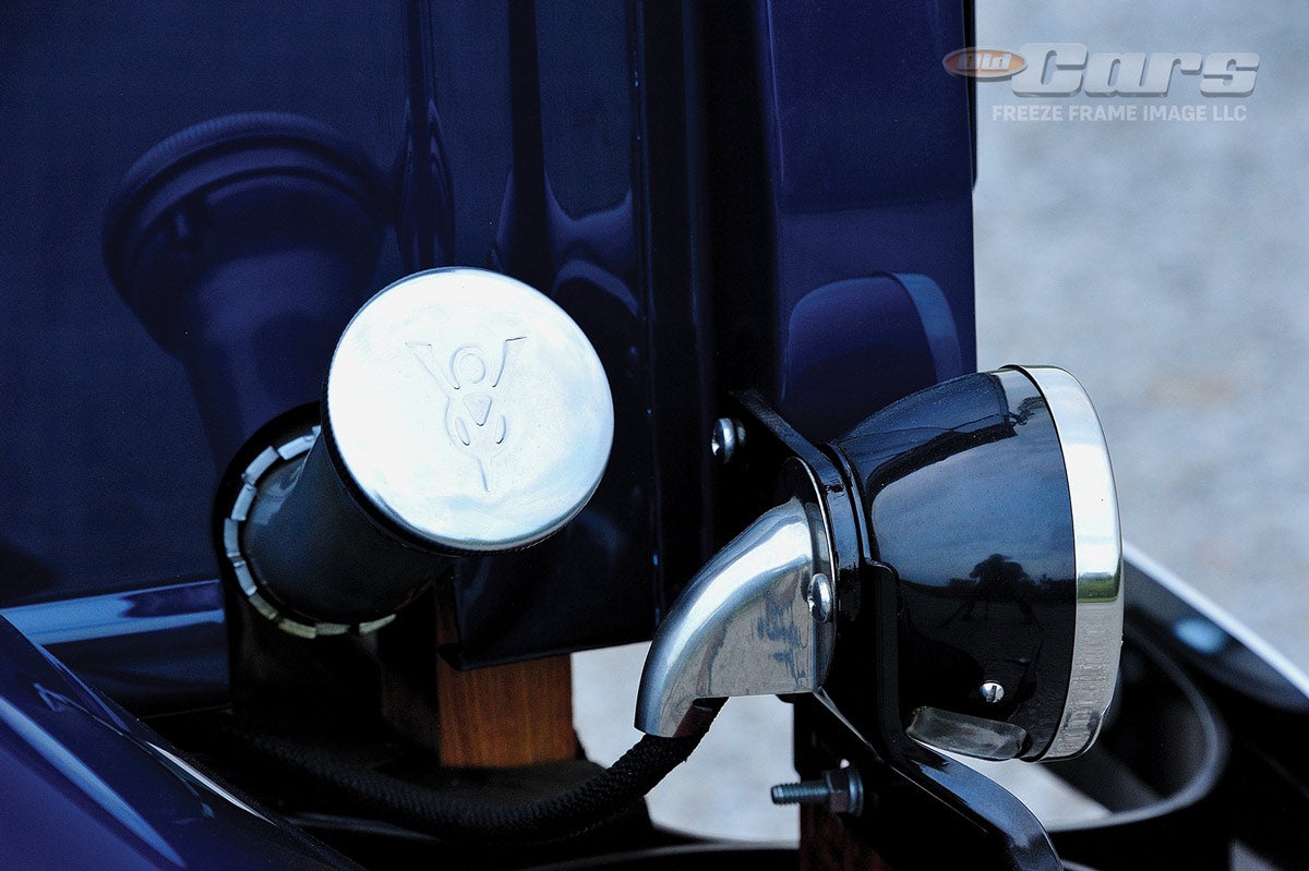 The fuel filler tube and taillamp are relatively close together on the 1936 Ford truck. Note the V8 emblem on the gas cap.
