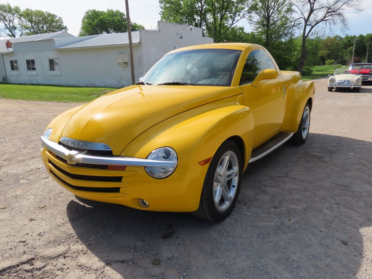 2004 bright yellow Chevrolet SSR pickup with only has 9,247 miles, runs and drives, black bucket seats and console, power steering, brakes, electric windows and locks, 5.3L V8 engine.