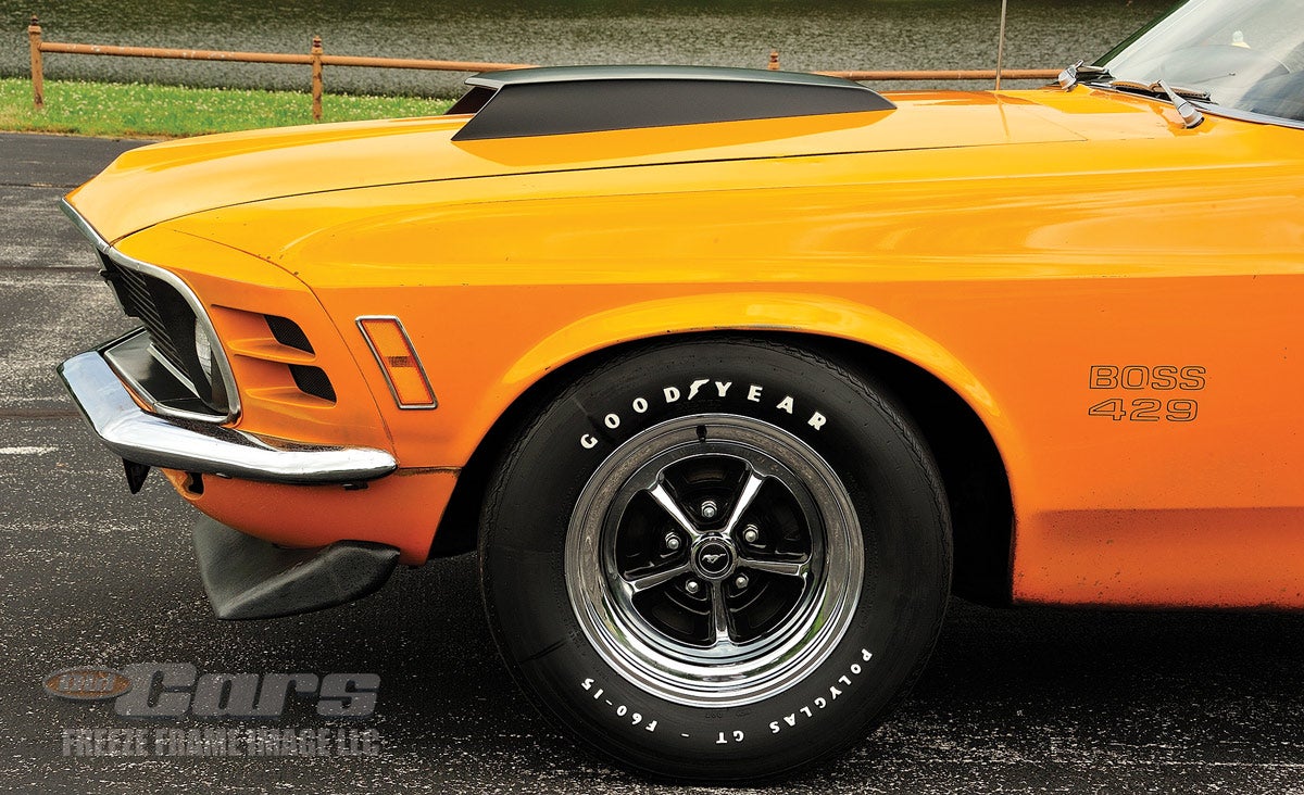All 1970 Boss 429 Mustangs had a matte black hood scoop (left).