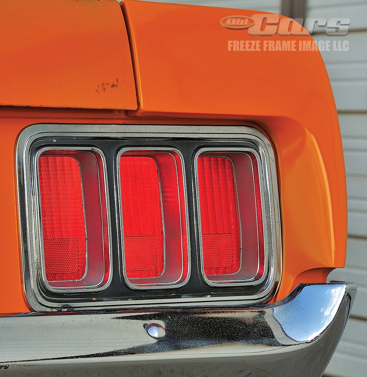 A close look at the paint on the tail panel and the chrome of the taillamp bezels reveals a hint of wear