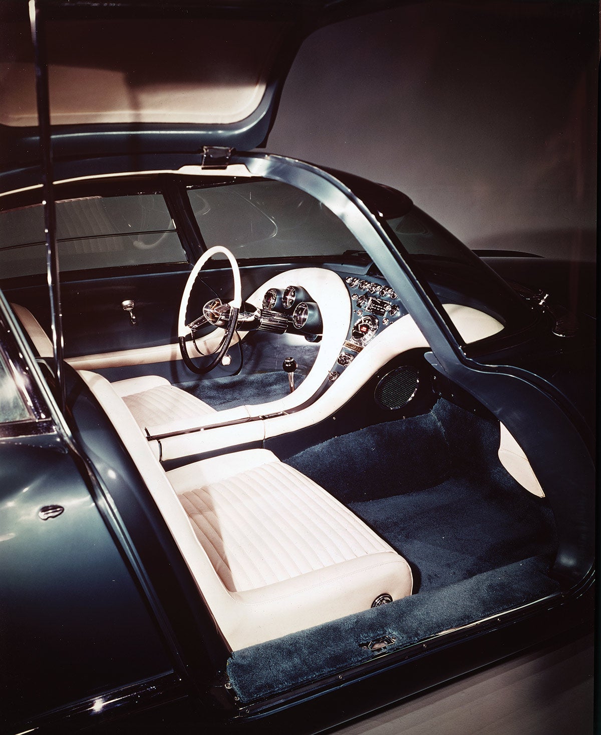 With doors raised, this view shows details of the Cougar 406’s comfortable and accessible passenger compartment. The Cougar 406 was fully functional, as evidenced by its use in the comedy “Under the Yum-Yum Tree.”