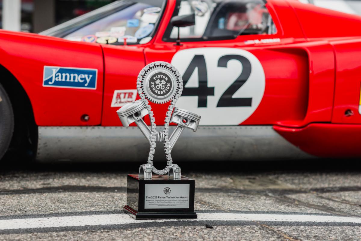 The Piston Technician Award sits in front of the 1969 Chevron B16, driven by Kurt Uzbay at Lime Rock, prepared and managed by KTR Racing.