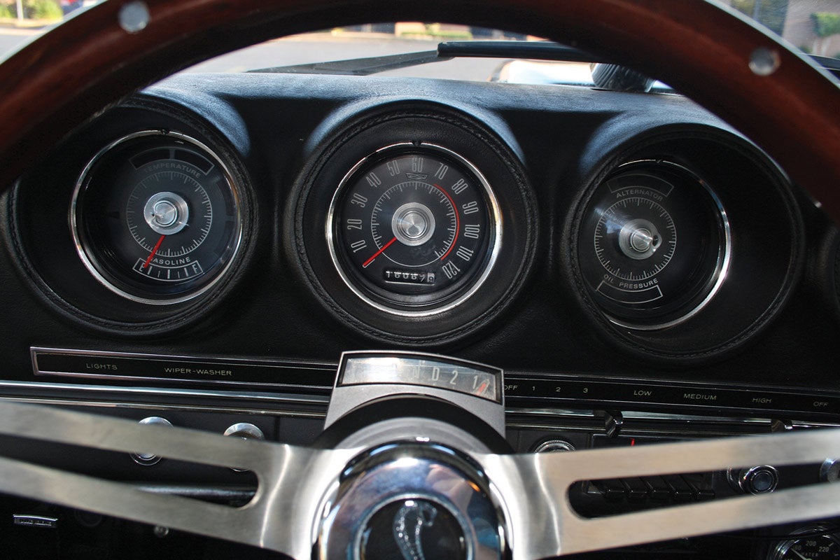 Instrumentation is contained within four round housings and is in easy sight of the driver; the instrument to the far right is out of frame and has a tachometer mounted in it.