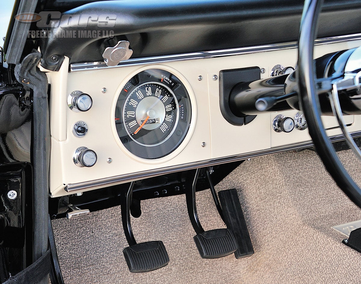 Loosening the knob beneath the dash pad allows the windshield to fold down.
