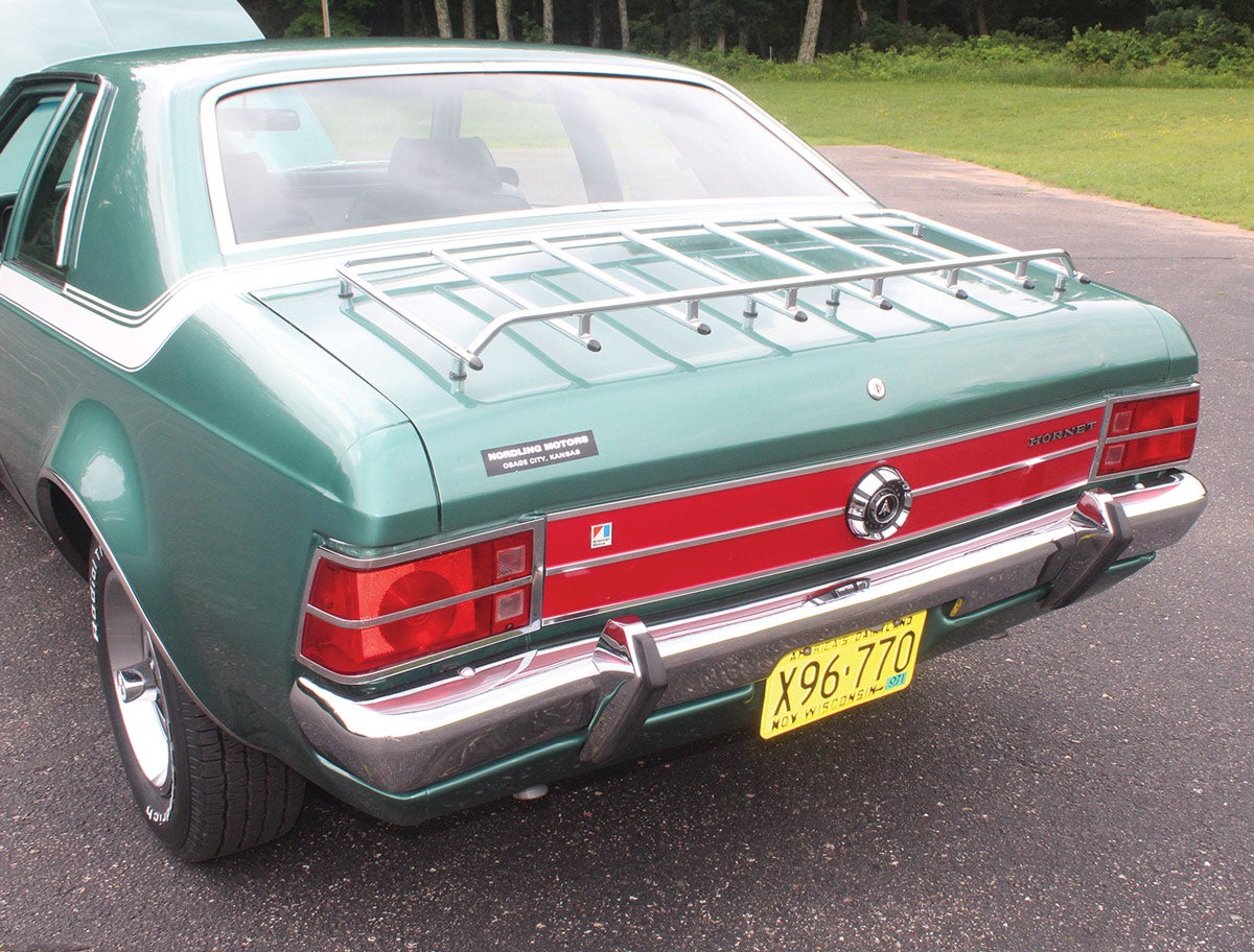The luggage rack was available for a whopping $32.45, and in the case of this car, it may have actually been put to good use. Pieczynski and the previous owner are convinced the stories of this fiery AMC actually being used by a USPS mail carrier as a rural delivery car are true. So maybe at one time there were mail bags riding on the rack? 