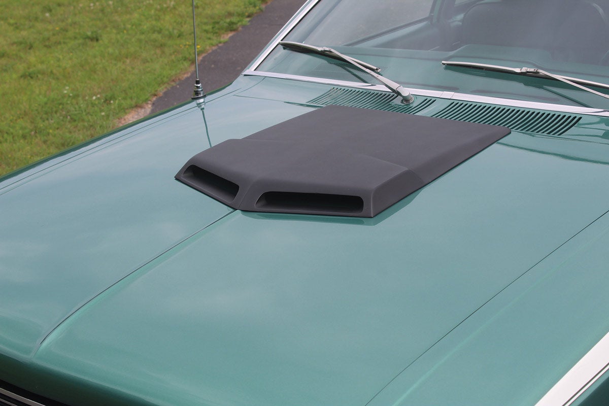 A flat-black Ram Air hood scoop sits prominently on the hood.
