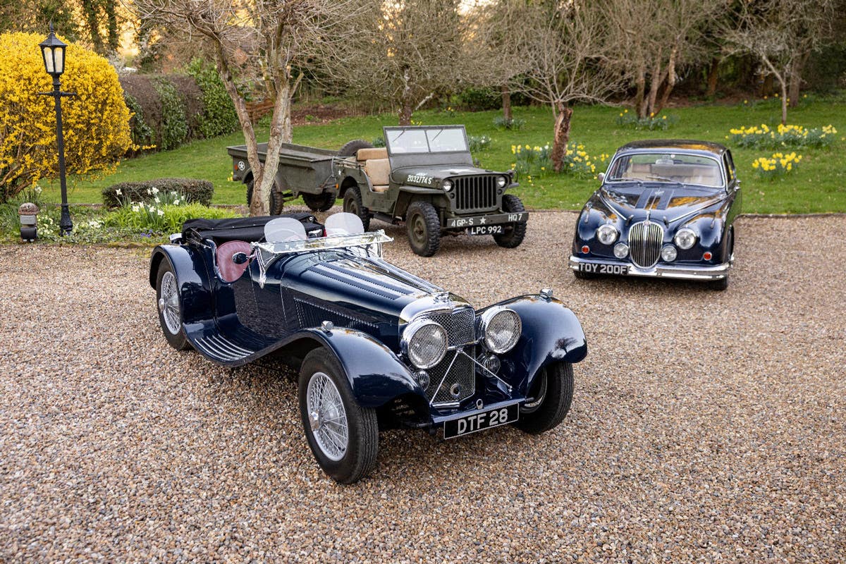 [L:R] The late Michael Turner’s 1939 Jaguar SS100, ex-military 1942 Ford 4x4 and trailer and 1968 Jaguar 340